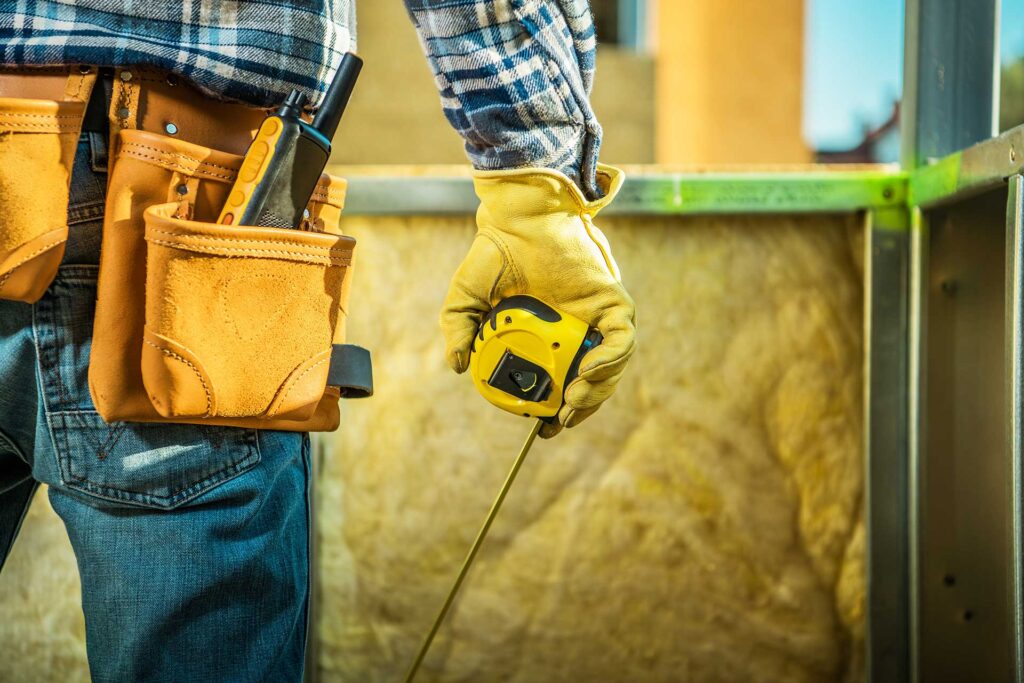 general contractor with tools in hand